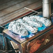 Making Tinfoil Baked Sweet Potatoes on a Tent Stove