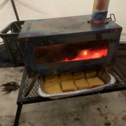 Making delicious bread with the help of tent stove