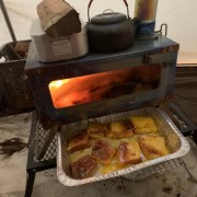 Making delicious bread with the help of tent stove